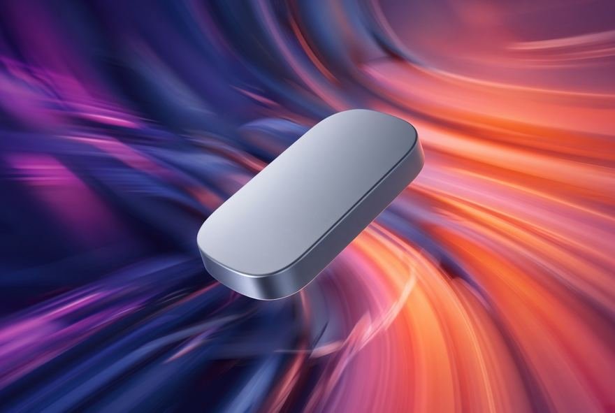A smooth capsule form lit against a blue gradient